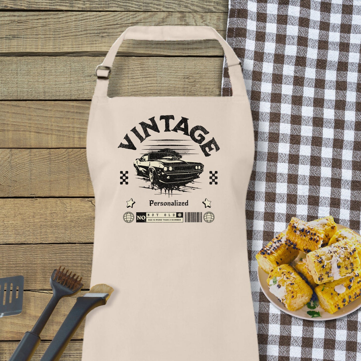 a white apron sitting on top of a table next to a plate of food