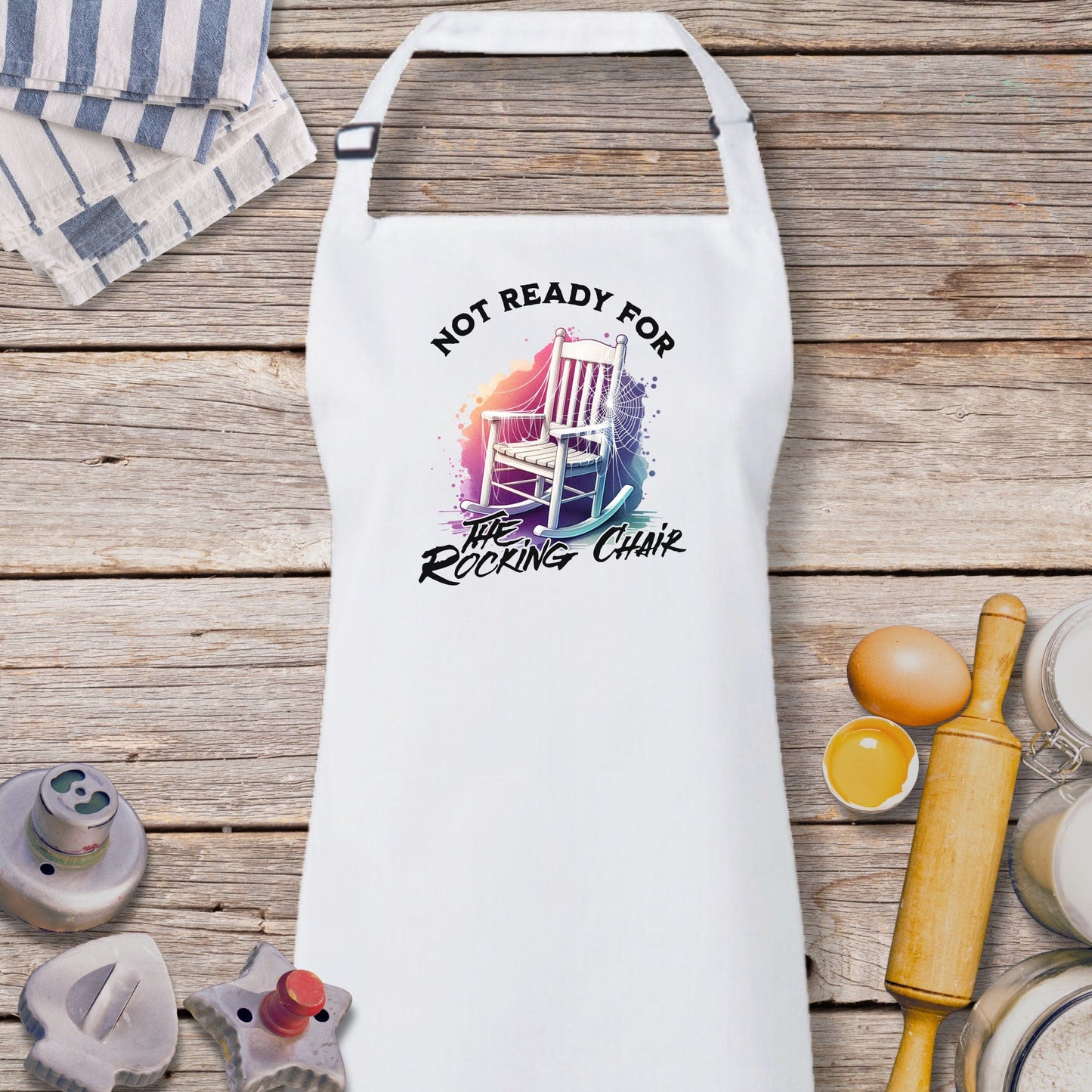 a white apron that says not ready for the rocking chair