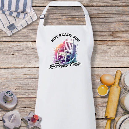 a white apron that says not ready for the rocking chair