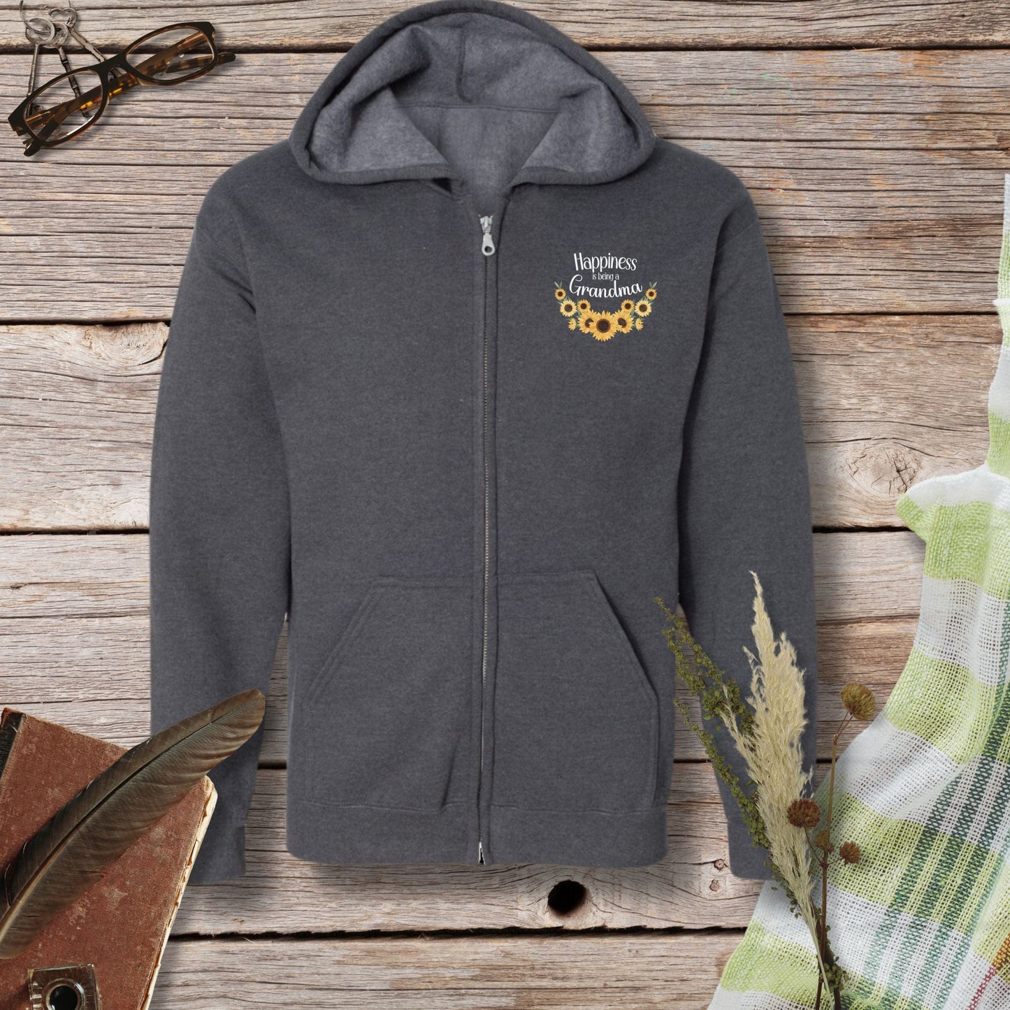 a gray hoodie with a picture of a sunflower on it