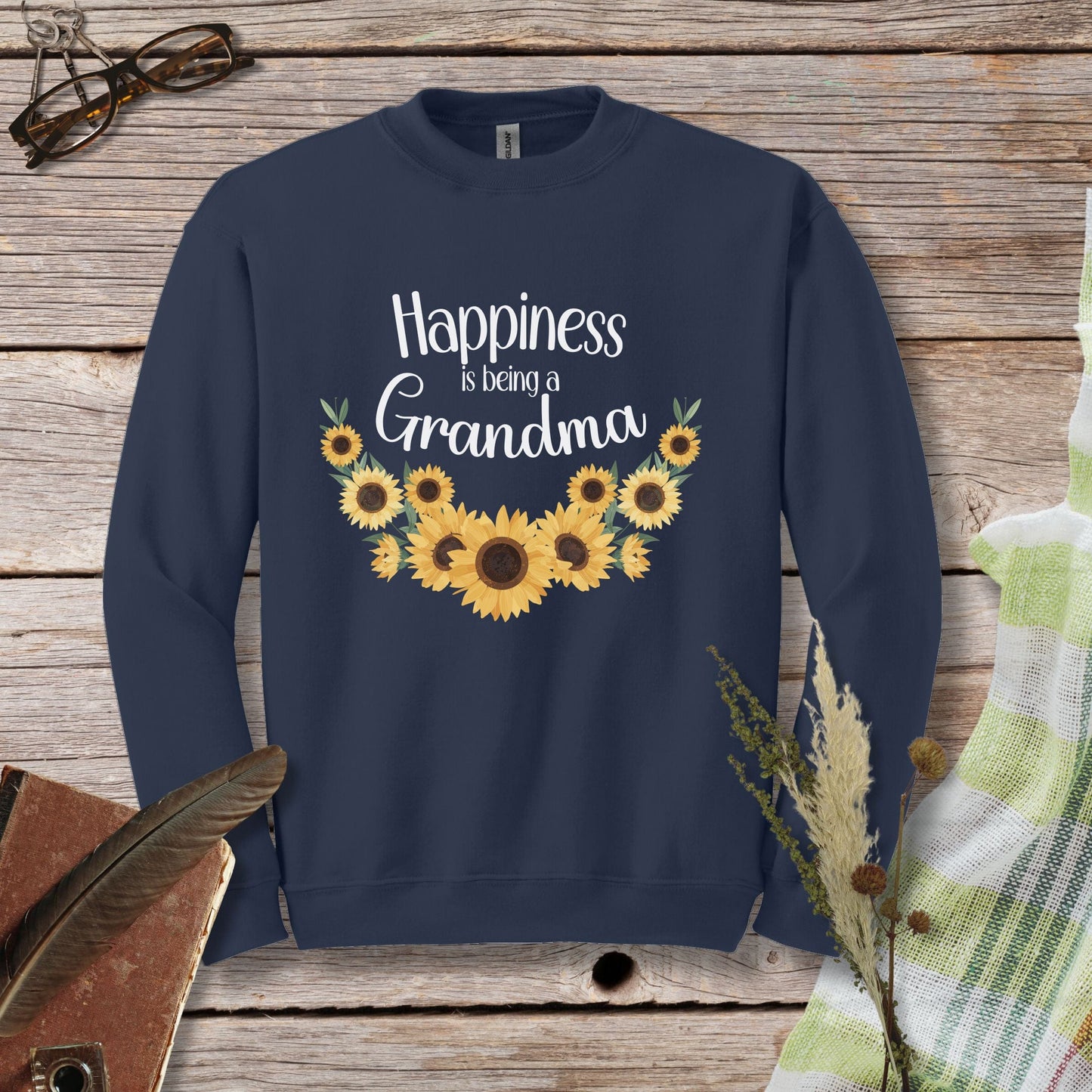 a sweatshirt that says happiness is being a grandma with sunflowers