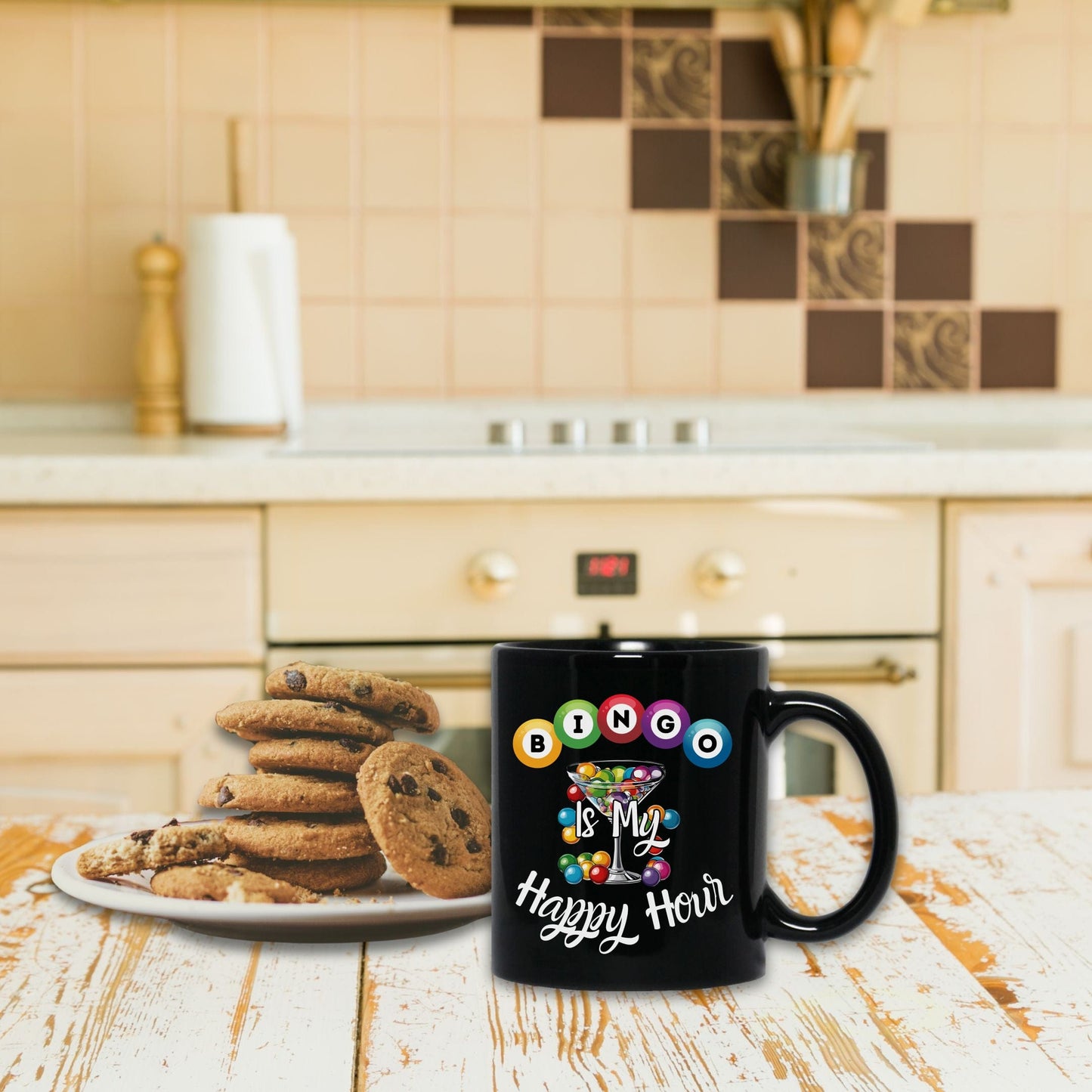 a happy new year mug next to a plate of cookies