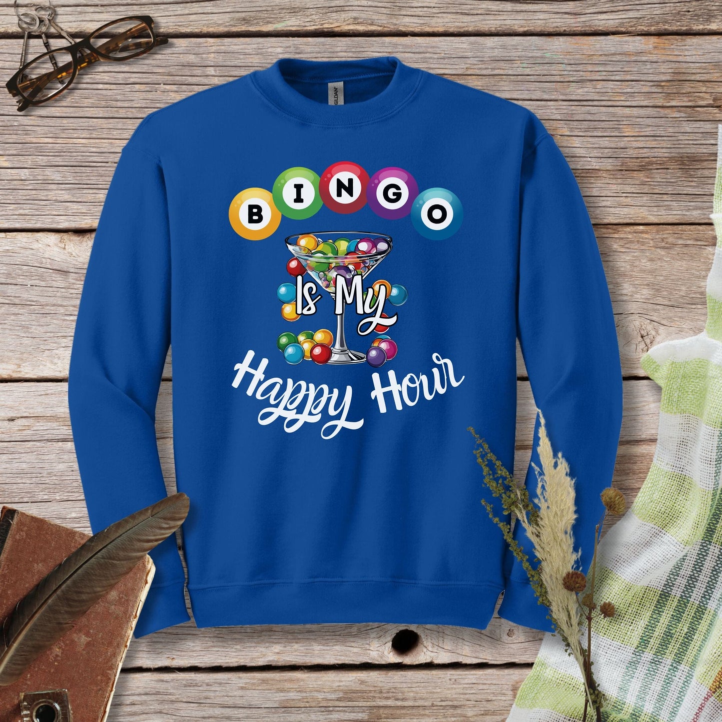 a blue sweatshirt with a happy hour design on it