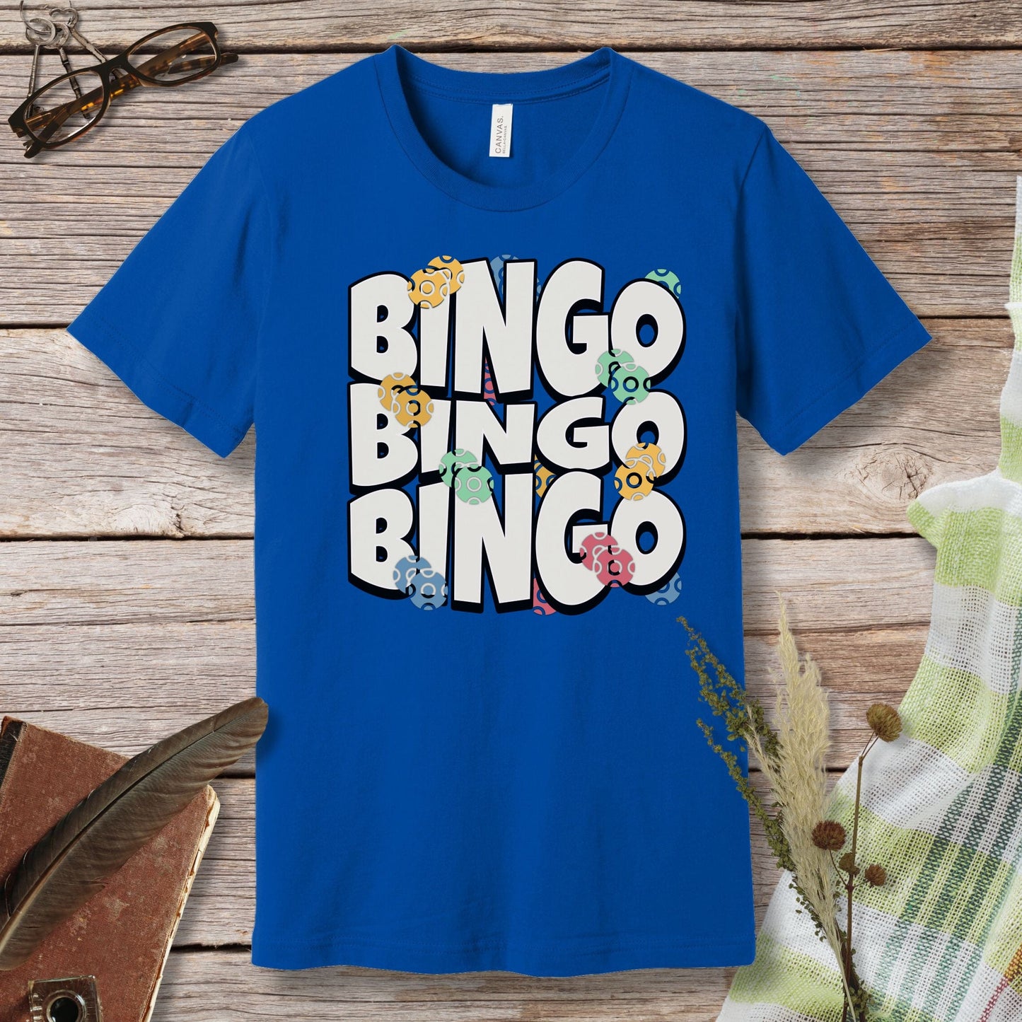 a blue t - shirt with the words bingo bingo on it