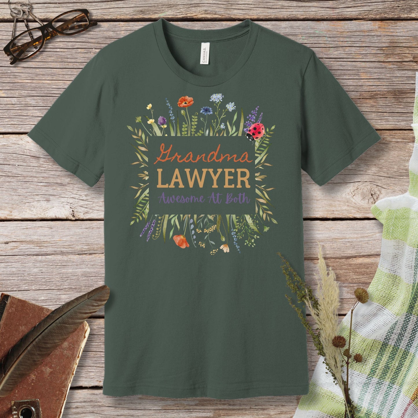 a green t - shirt with the words grandma's lawyer on it