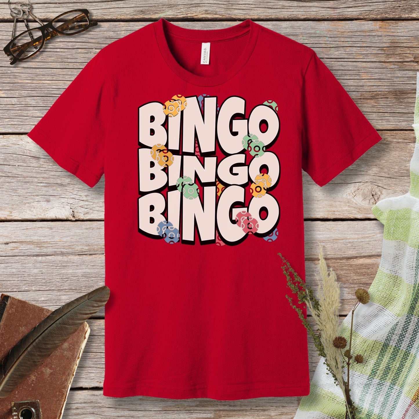 a red t - shirt with the words bingo bingo bingo on it