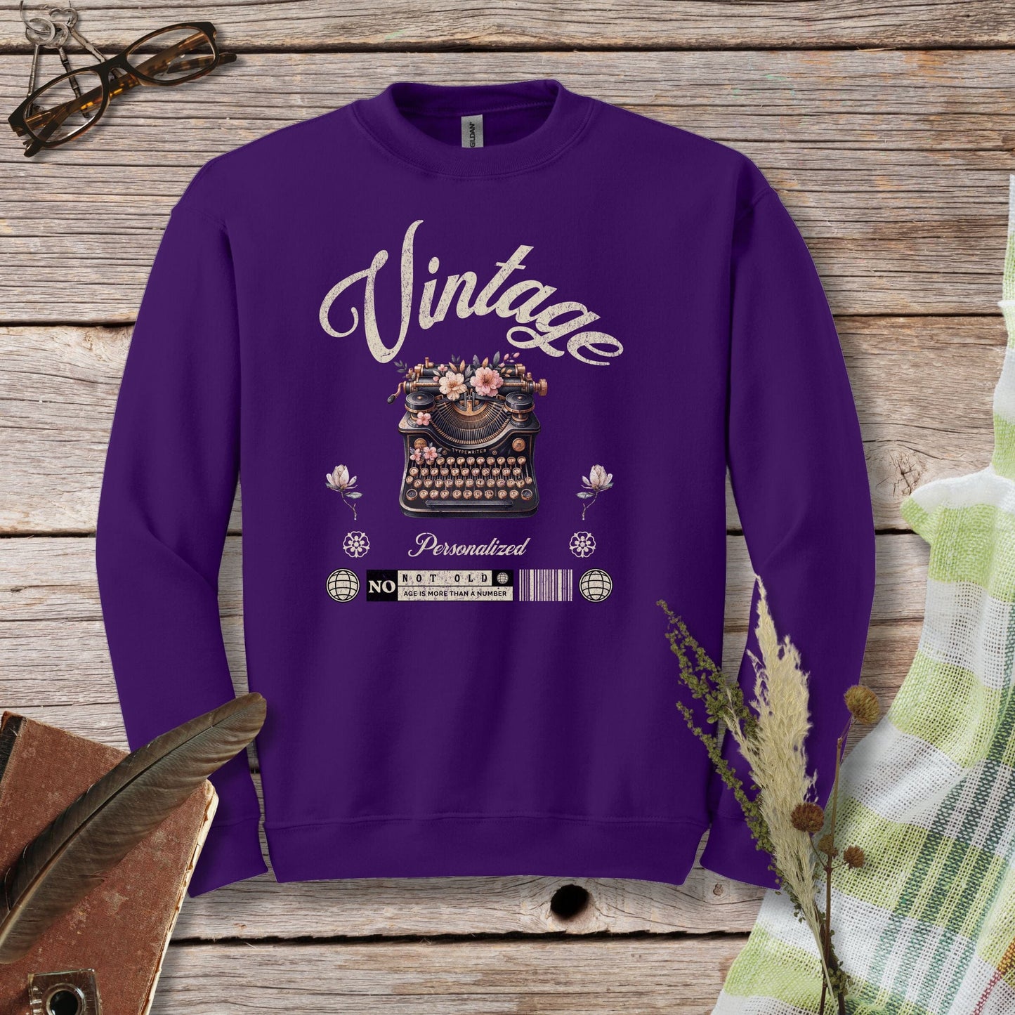 a purple sweatshirt with the words vintage printed on it