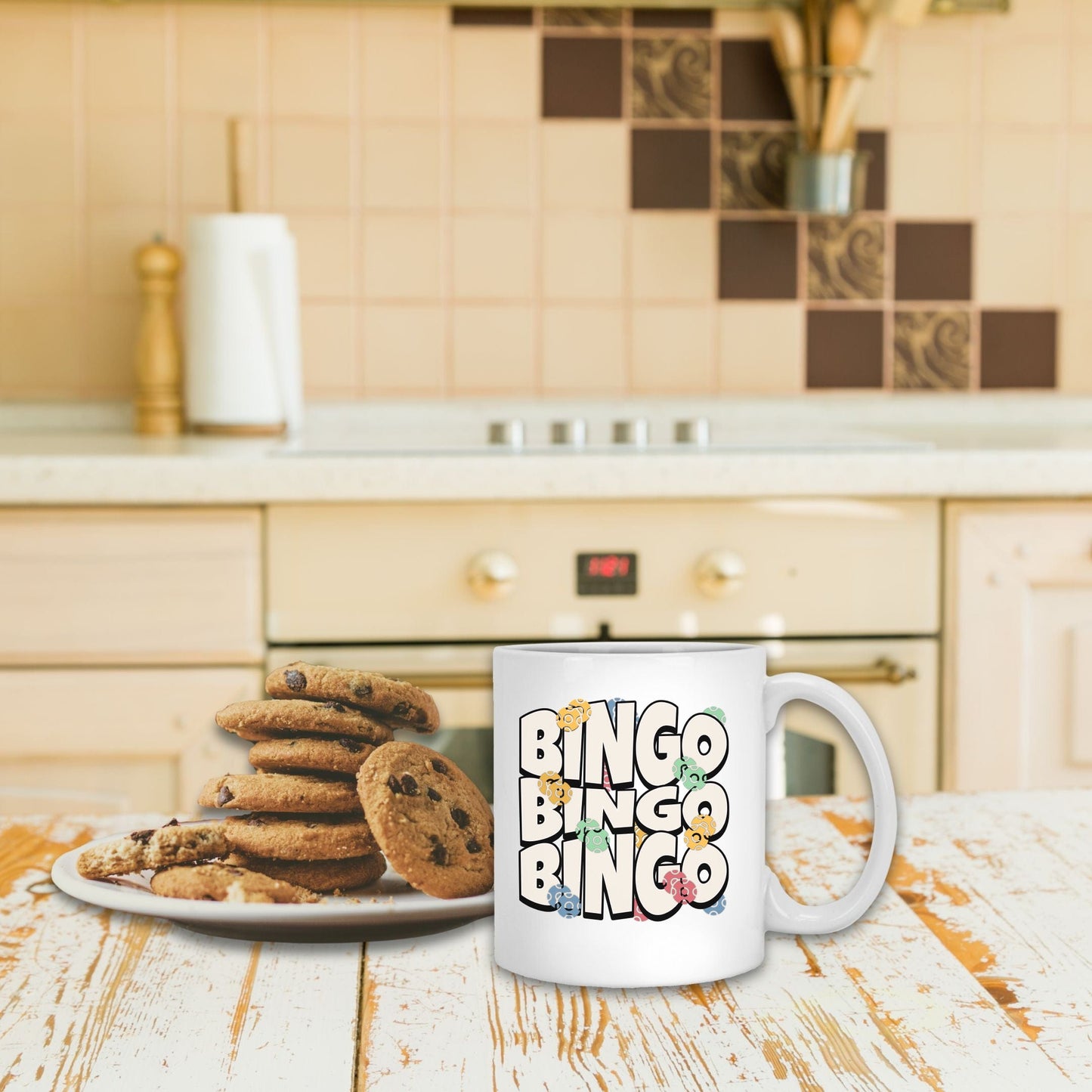 a plate of cookies and a mug on a table