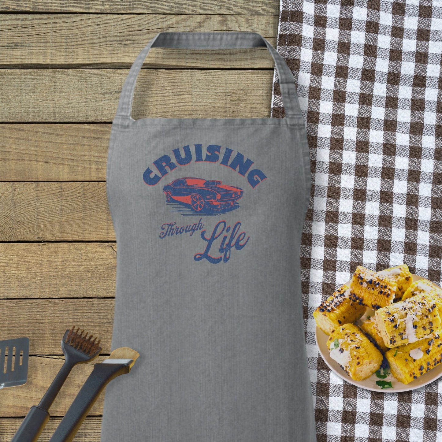 a plate of food sitting next to a gray apron