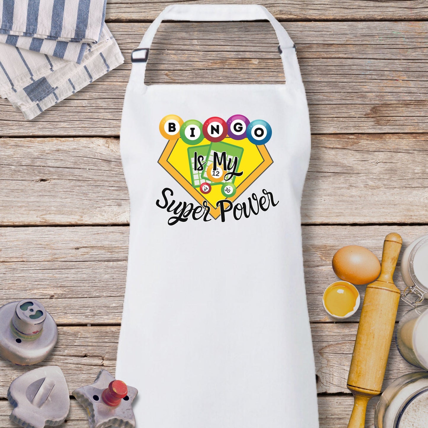 a white apron with the words bingo and my super power on it