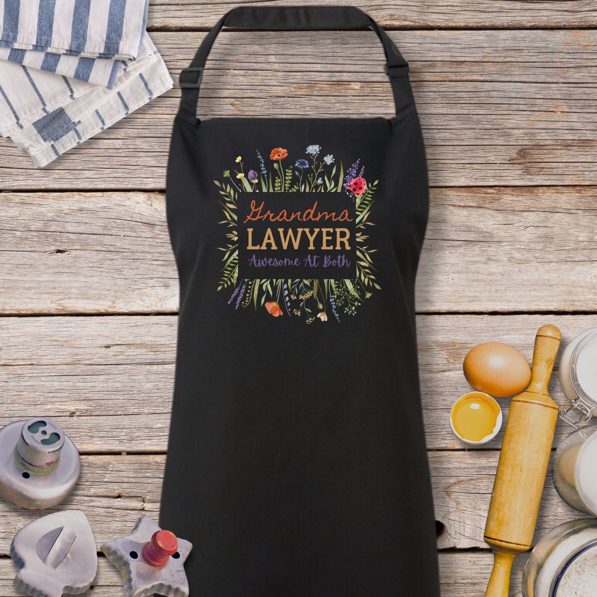 a black apron sitting on top of a wooden table