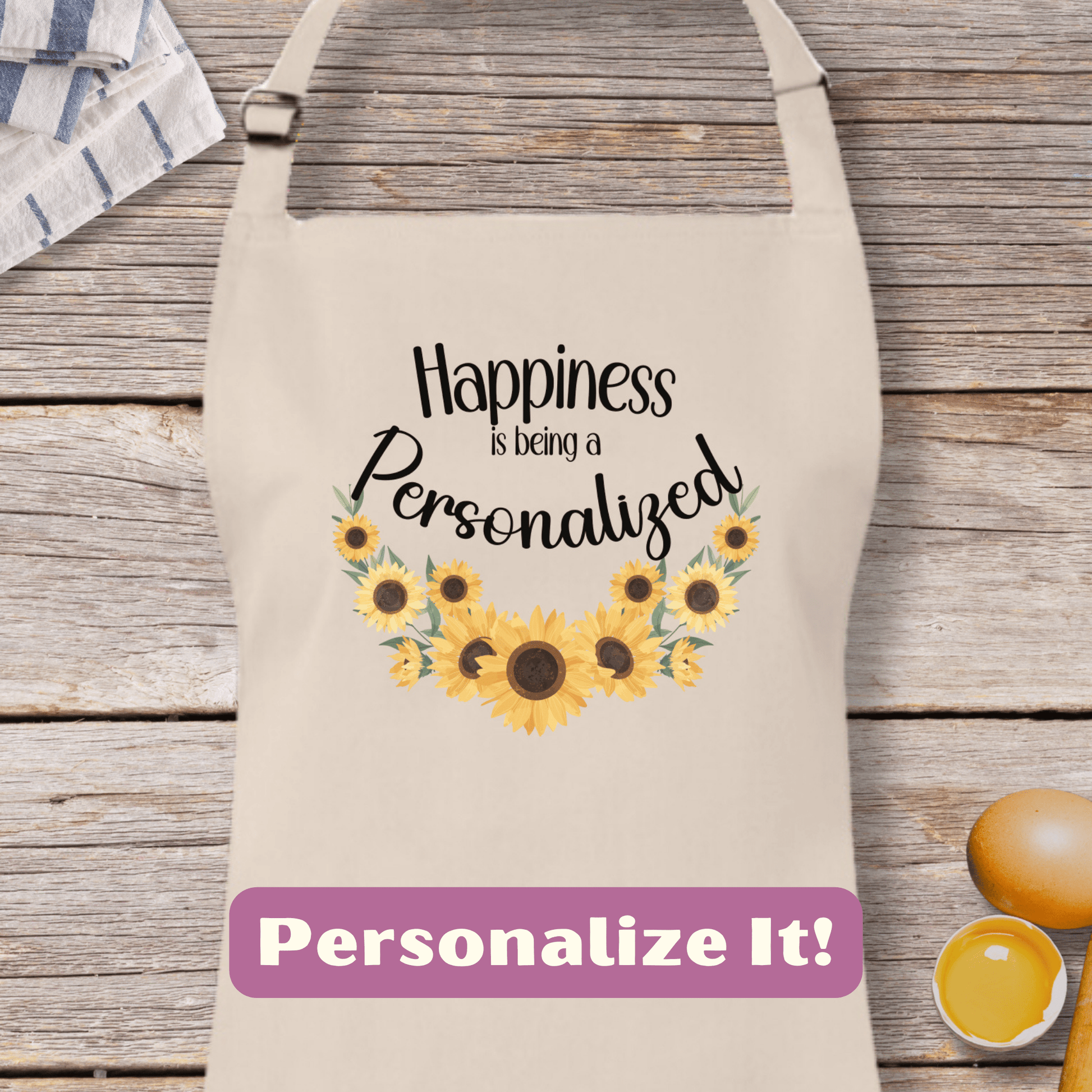 a personalized apron with sunflowers on it