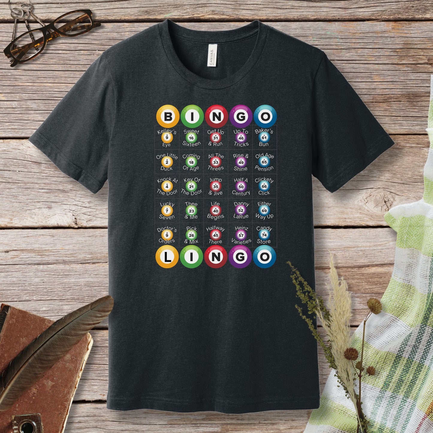 a black t - shirt with a number of different items on it