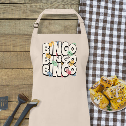 a white apron with the words bingo bingo on it next to a plate