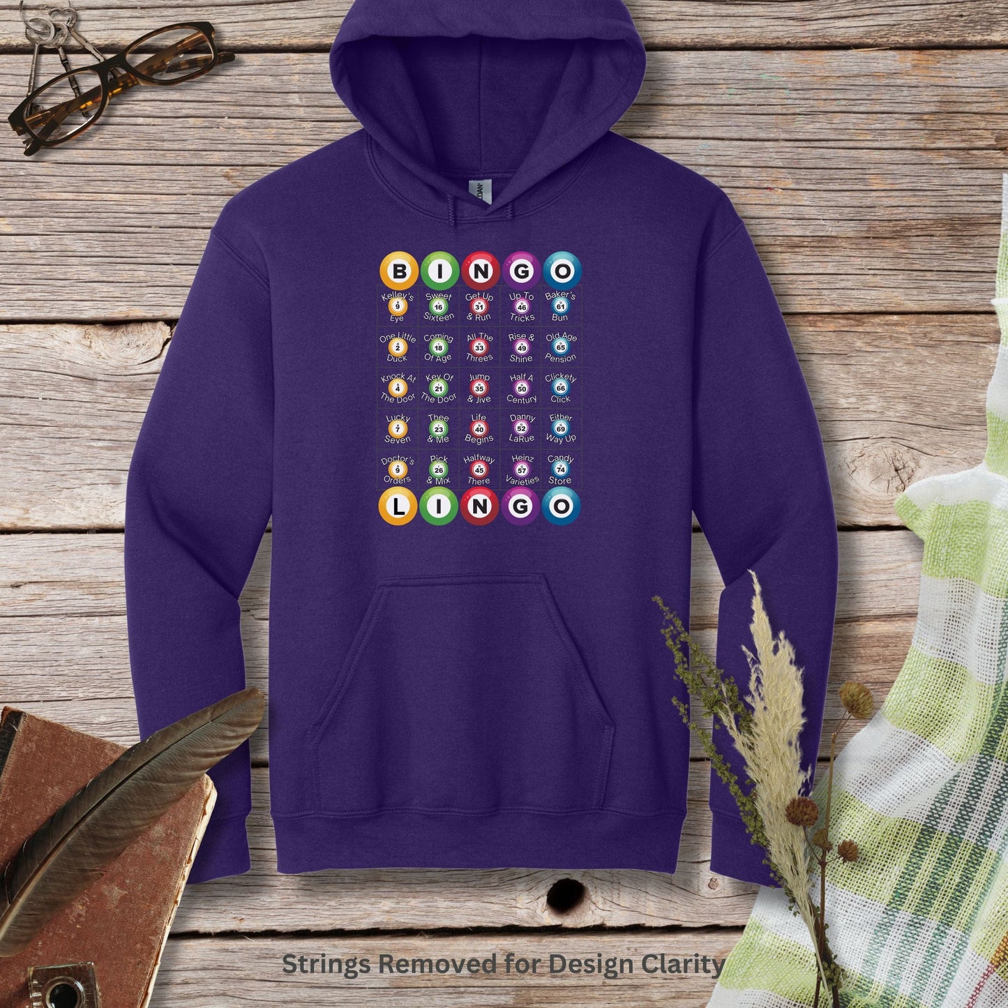 a purple hoodie with a bunch of buttons on it