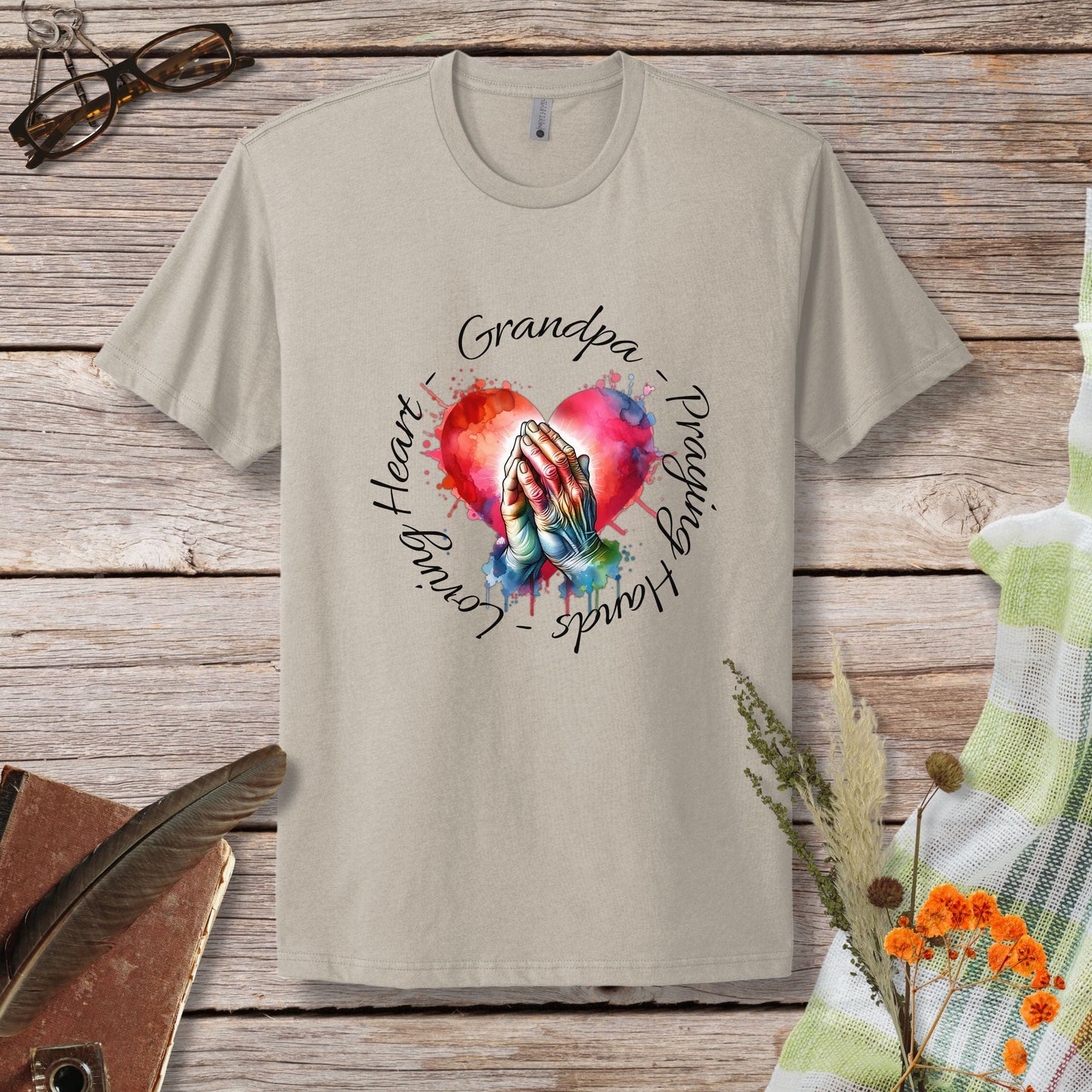 a t - shirt with a picture of a hand holding a heart