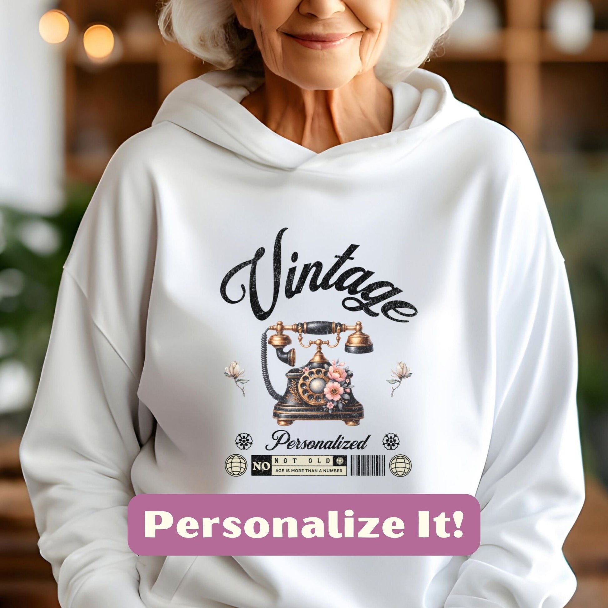 an older woman wearing a white hoodie with the words vintage personalize it