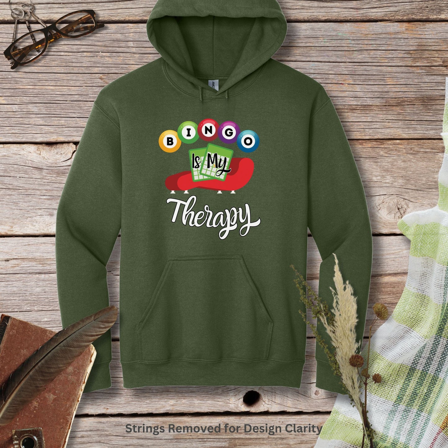 a green hoodie that says is my therapy on it