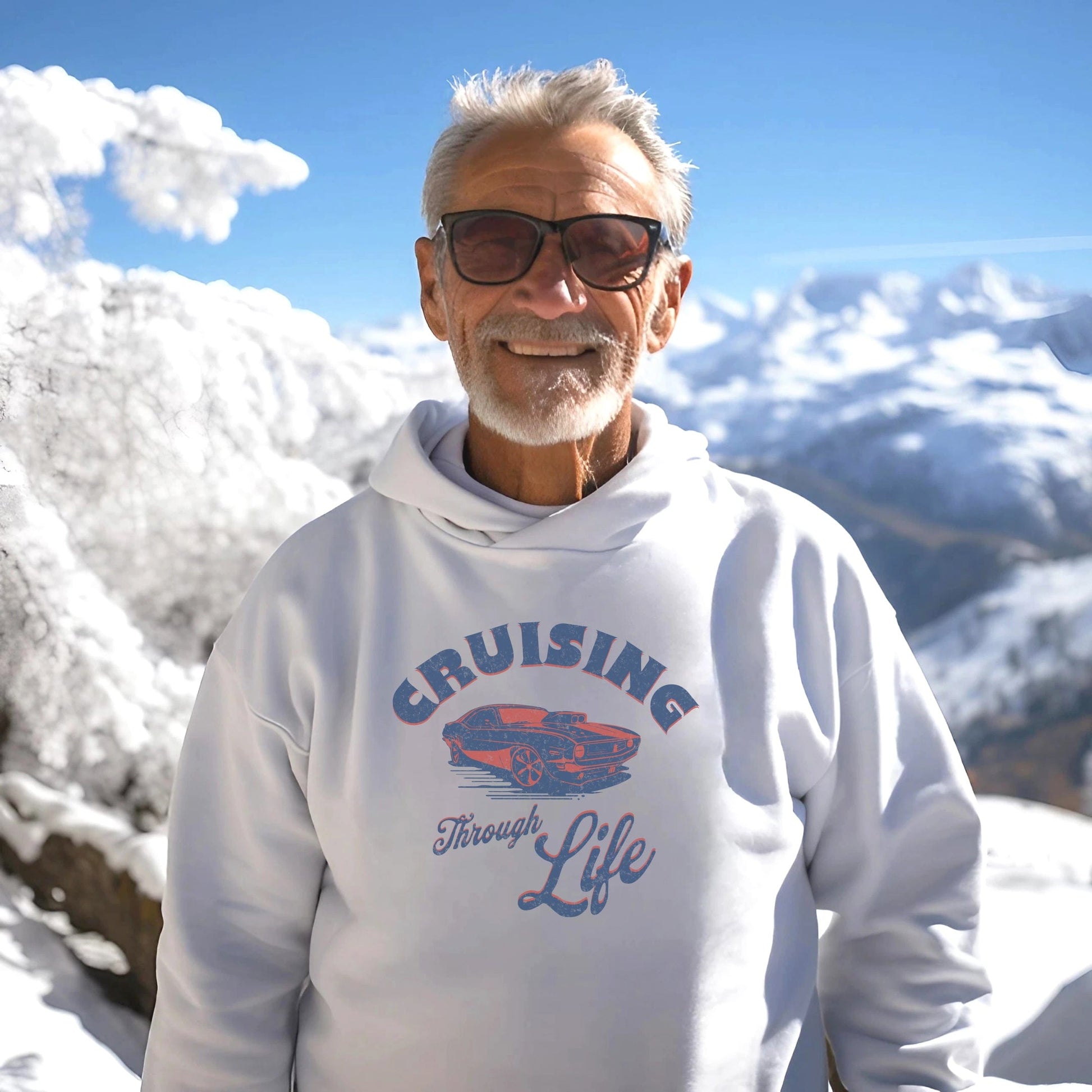 a man in a white hoodie standing in the snow