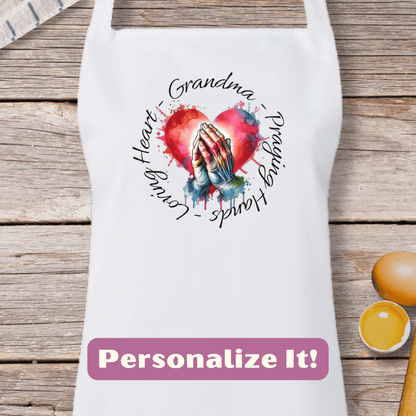 a white apron with a picture of a hand holding a heart