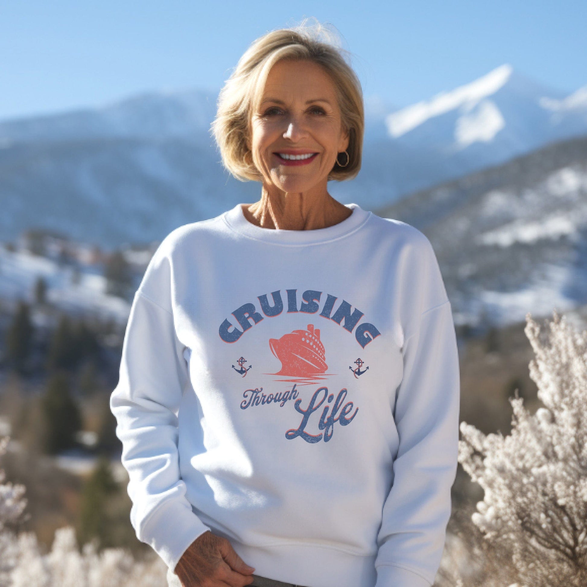 a woman standing in front of a snowy mountain