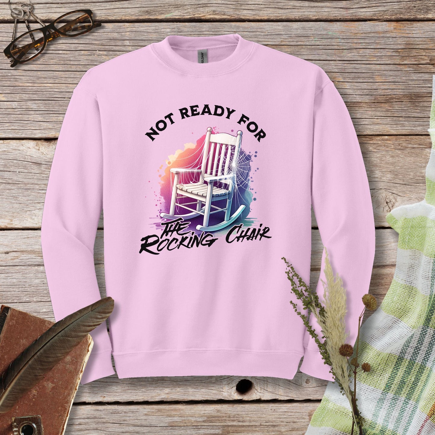 a pink sweatshirt that says not ready for the rocking chair