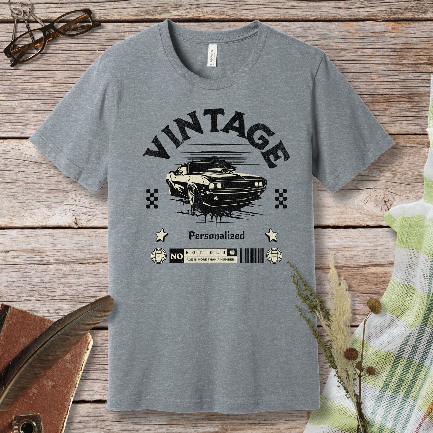 a gray t - shirt with a picture of a car on it