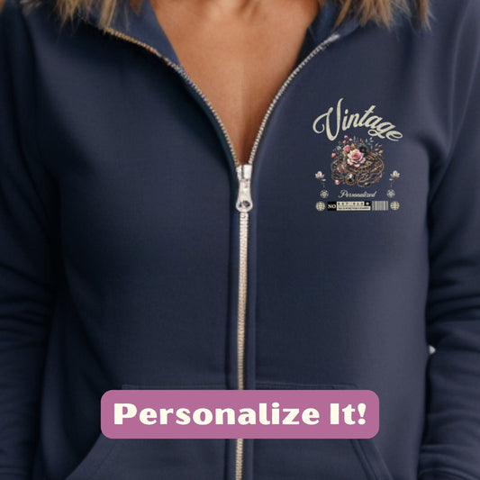 a woman wearing a blue zip up hoodie with the words vintage on it