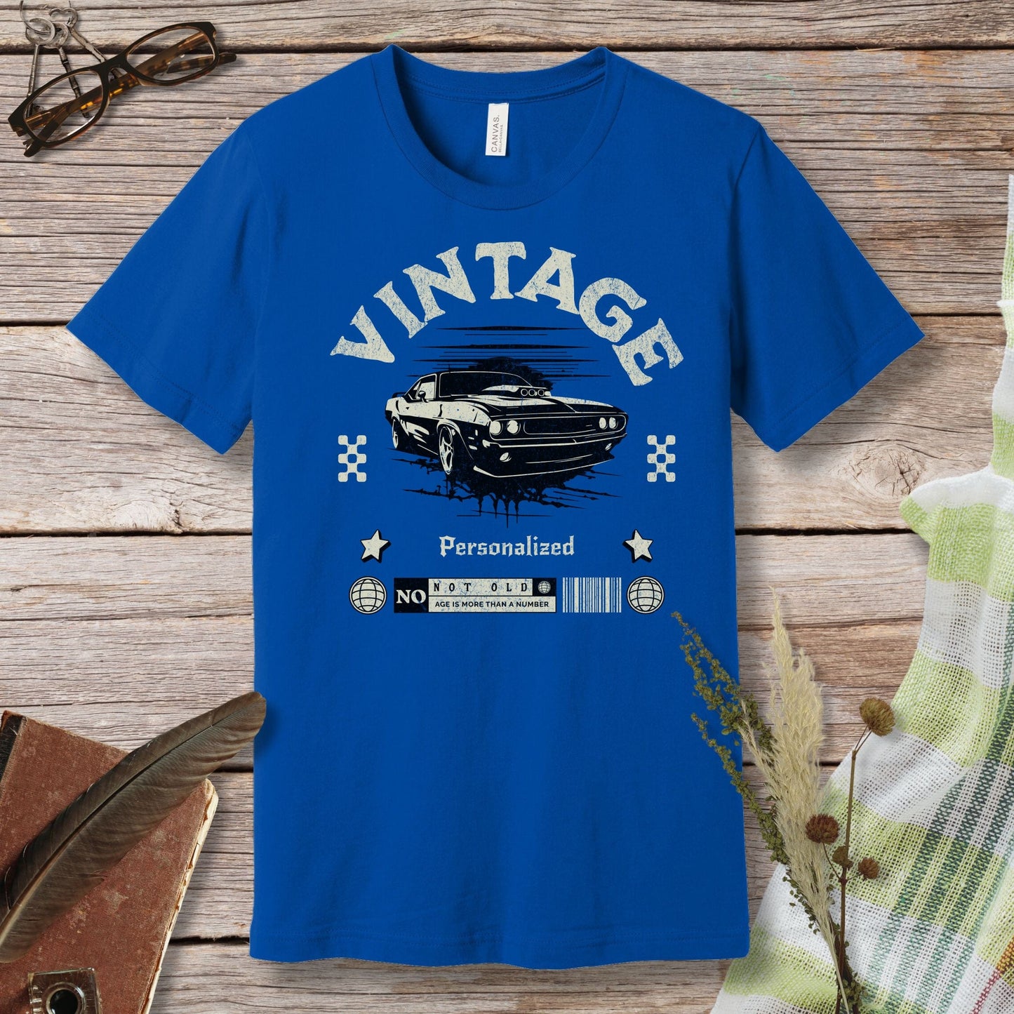 a blue t - shirt with a vintage car on it