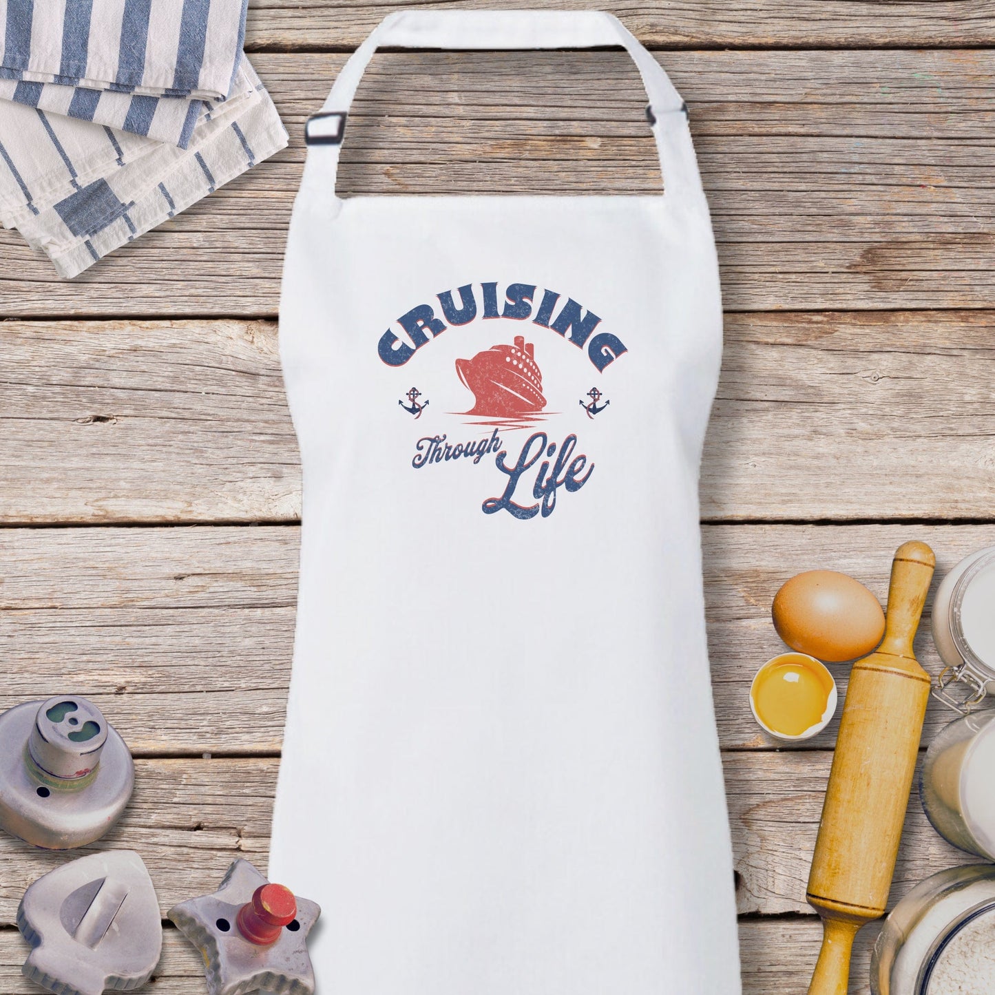 a white apron sitting on top of a wooden table