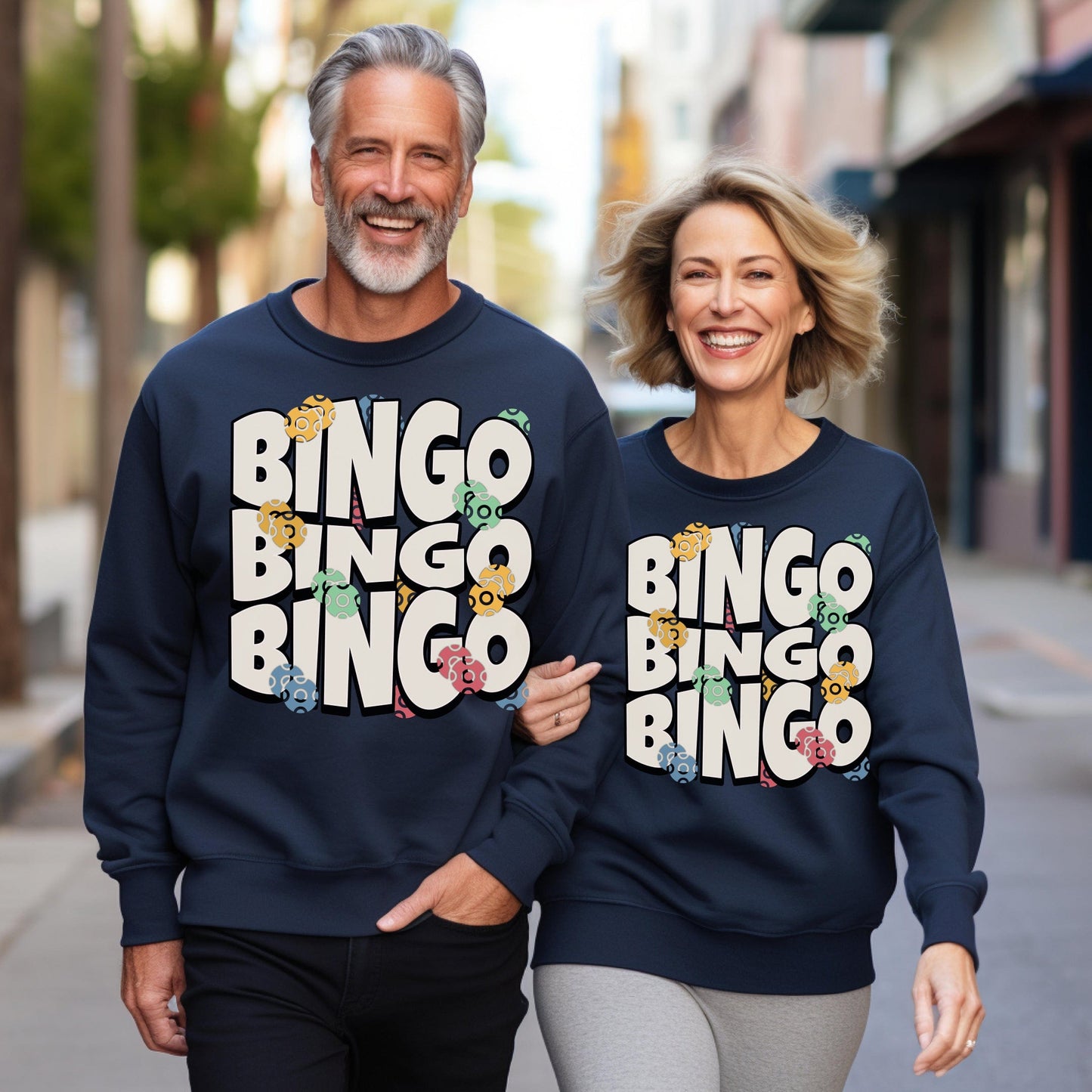 a man and a woman wearing matching sweatshirts