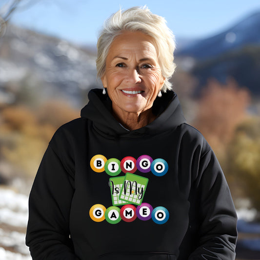 a woman wearing a black hoodie with a game on it