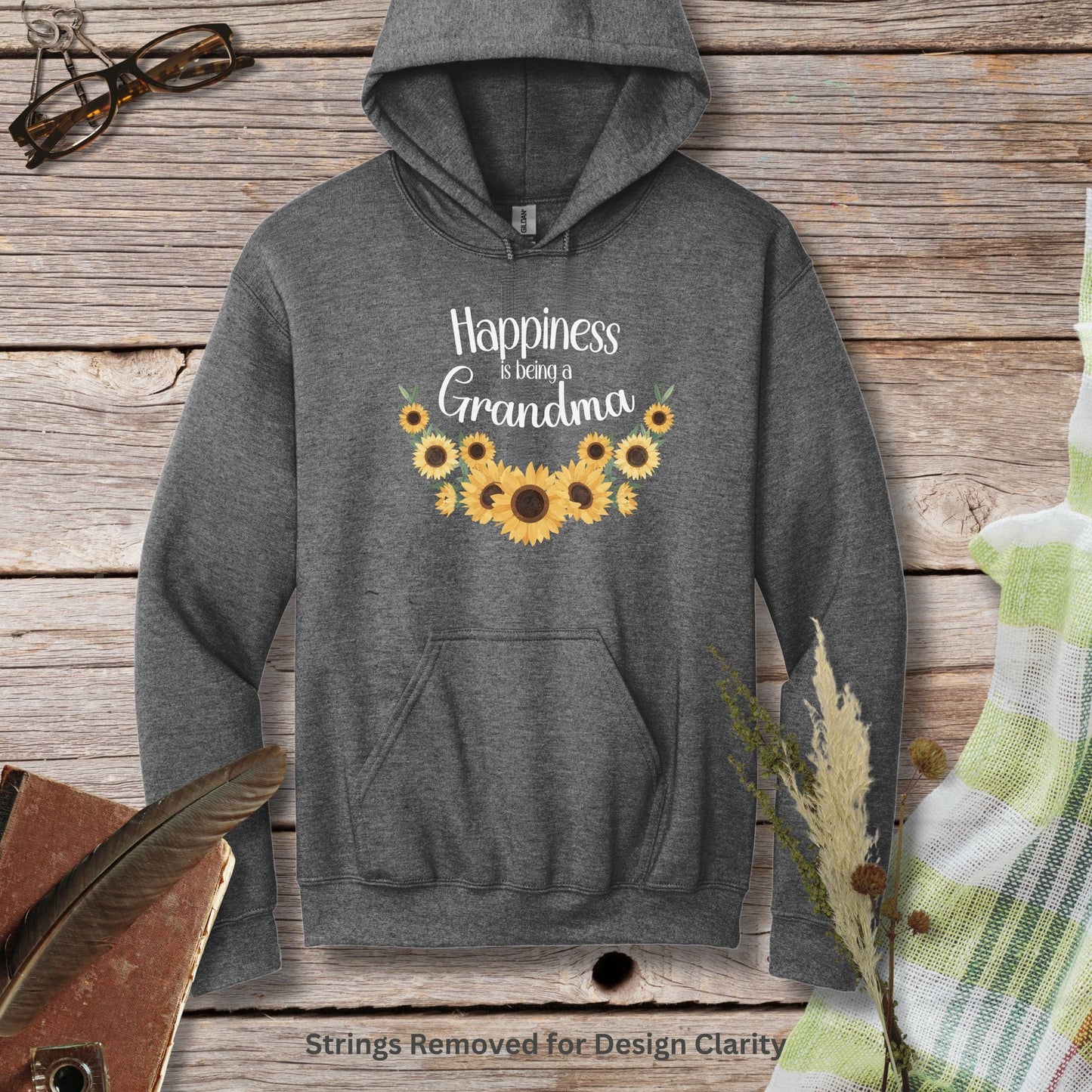 a gray sweatshirt with sunflowers and the words happiness is not grandma on it