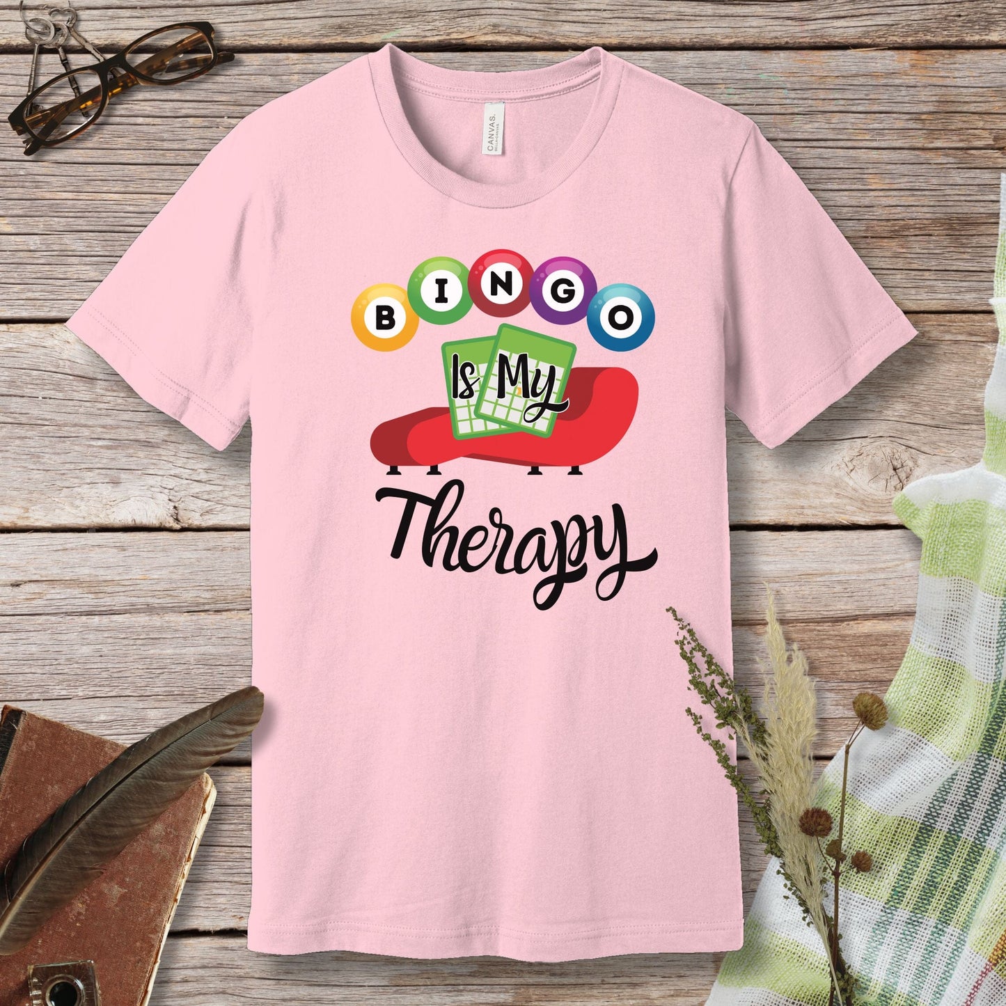 a pink shirt that says boo is my therapy