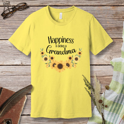 a yellow t - shirt that says happiness is being grandma