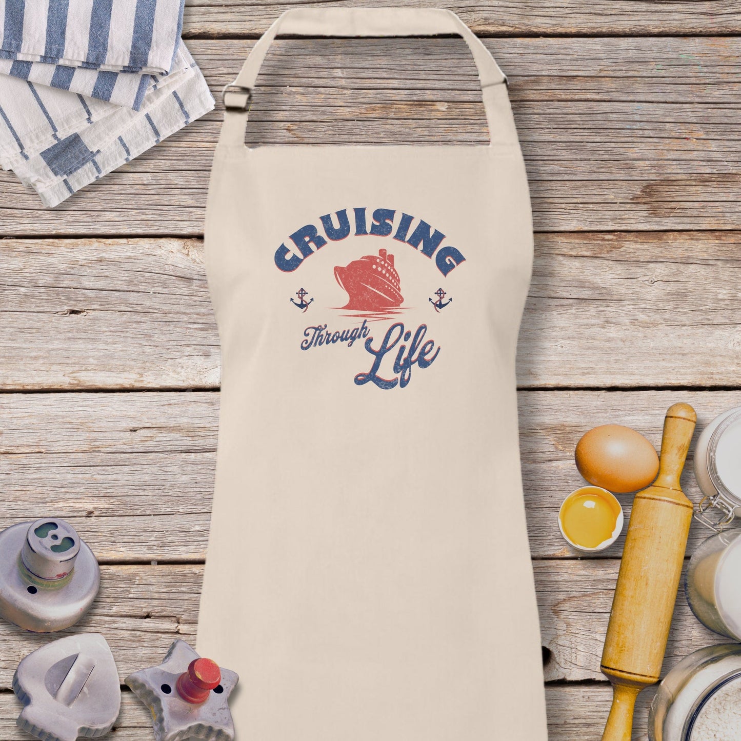 a white apron sitting on top of a wooden table