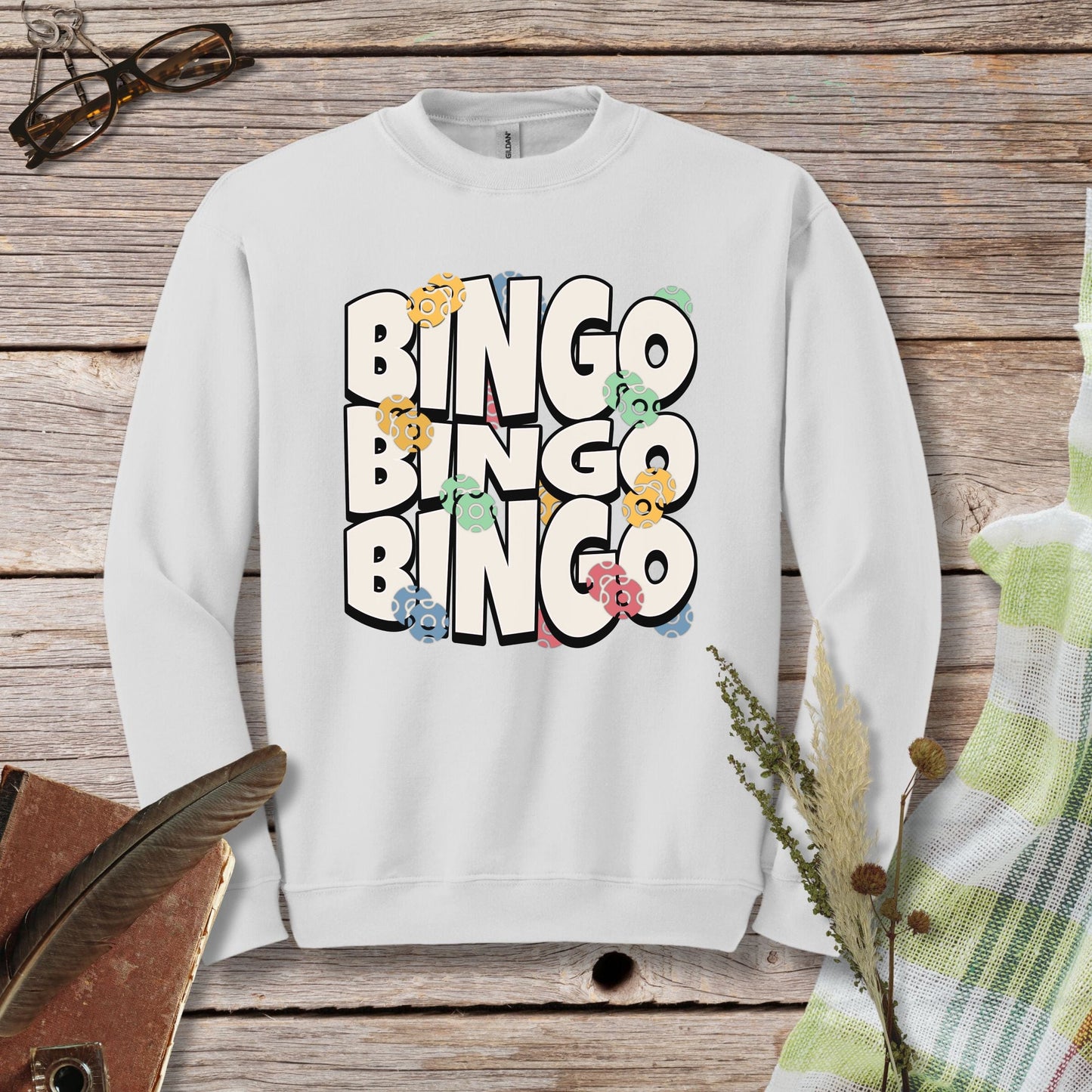 a white sweatshirt with the words bingo bingo on it