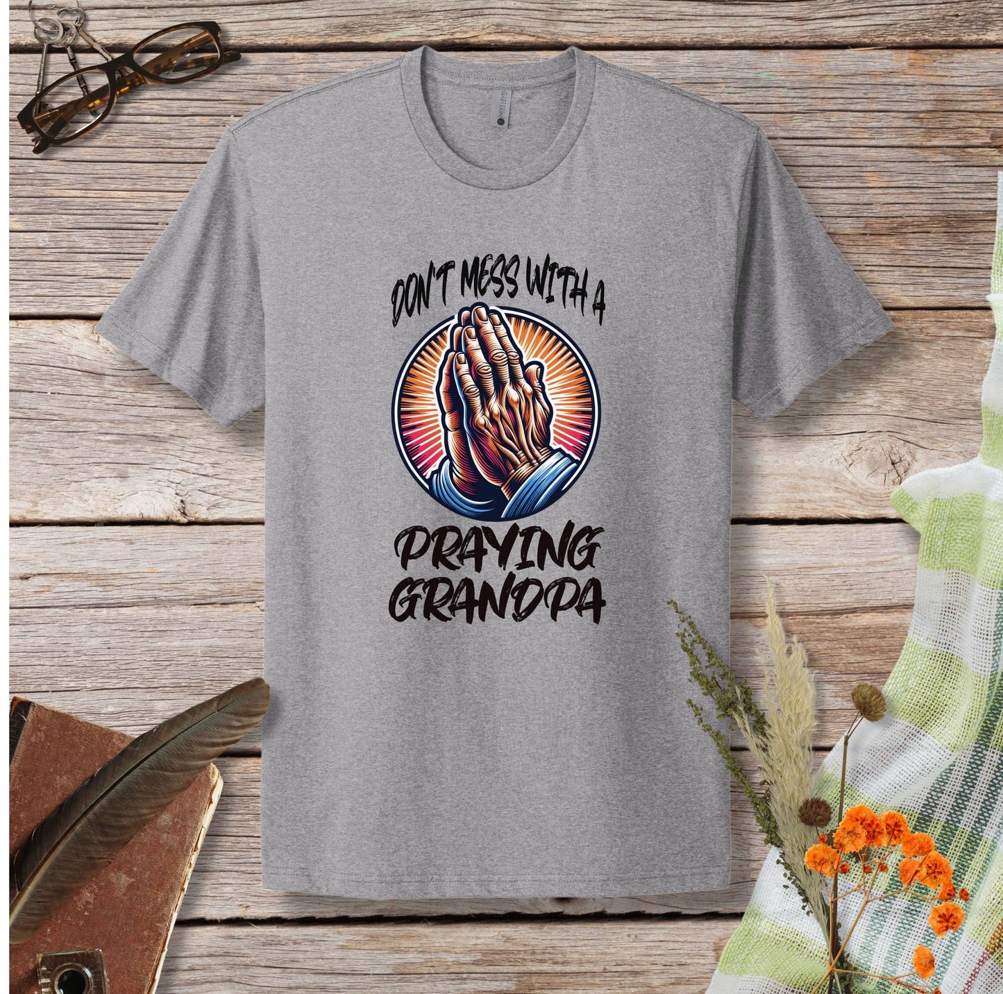 a gray t - shirt with the words don't mess with a praying grandpa